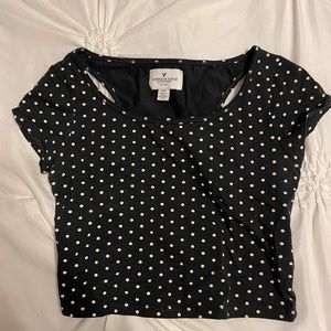Black and white polkadotted crop top with cut outs on the back